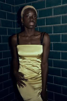 Creative Highlights Symbolfotos Young blonde black woman outdoors. She is wearing yellow dress Wroc?aw, Lower Silesian Voivodeship, Poland CR_PJWUOI241216-1601946-01 ,model released, Symbolfoto