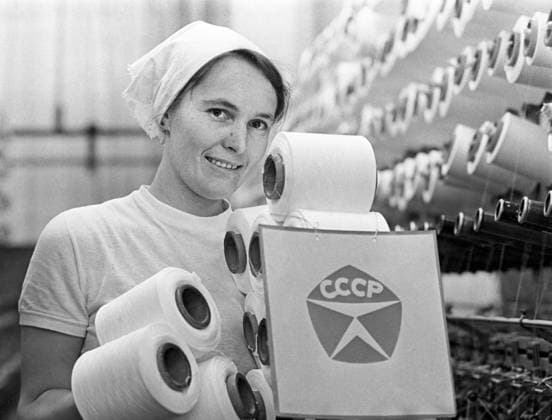 One of the Soviet Union s best factory workers poses in 1976 near the sign that symbolized quality-made USSR (CCCP in the Russian acronym) products. She worked at the Red Sign Knitting and Hosiery Factory in then-Leningrad. The textile industry fell onto hard times after the collapse of the Soviet Union in 1991. (B. Chervyakov ITAR-TASS-KRT) MOSCOW RUS EDITORIAL USE ONLY Copyright: xx 1030362 B.xChervyakovx krtphotoslive213804