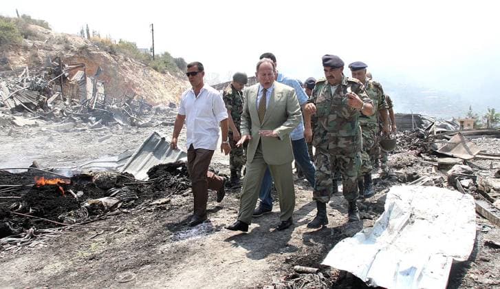 Lebanese President Emile Lahoud inspects the destruction at a Lebanese Army transportation unit in the Jamhour area of Lebanon, July 18, 2006. (Balkis Press Abaca Press MCT) LBN EDITORIAL USE ONLY Copyright: xx 1032787 BalkisxPressx krtphotoslive221371