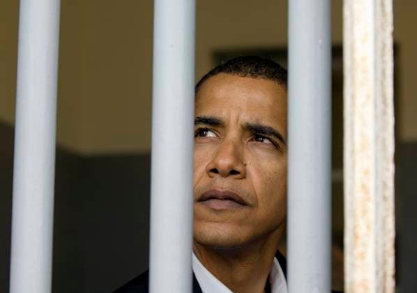 Sen. Barack Obama (D-Ill.) peers out of what was Nelson Mandela s prison cell on Robben Island off the coast of Cape Town, South Africa, Sunday, August 20, 2006. (Pete Souza Chicago Tribune MCT) KEN EDITORIAL USE ONLY Copyright: xx 1034078 PetexSouzax krtphotoslive224610