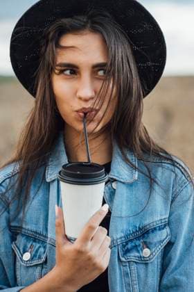 Creative Highlights Symbolbilder Portrait of young woman drinking beverage model released, Symbolfoto, VPIF00894