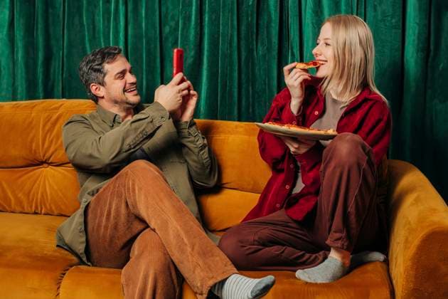 Couple sitting on couch and enjoying at home model released, Symbolfoto property released, VSNF02708