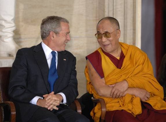 Dalai Lama Tenzin Gyatso, the 14th Dalai Lama of Tibet, shares a laugh with President George W. Bush during ceremony at which the Lama received a Congressional Gold Medal. Washington D.C. USA EDITORIAL USE ONLY Copyright: xx TomxWilliamsx rollcallpix039045