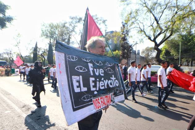 A person taking part during a demonstration for the 43 missing students from Ayotzinapa from the Glorieta de Peralvillo to the Basilica of Guadalupe. on December 26, 2024 in Mexico City, Mexico. Mexico City Mexico - ZUMAe321 20241226_zia_e321_050 Copyright: xCarlosxSantiagox