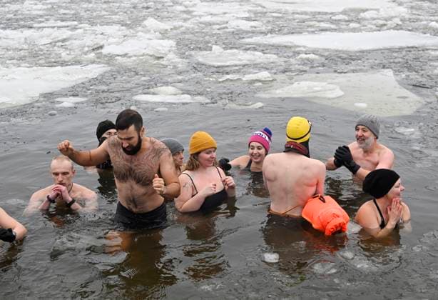 January 1, 2025, Quebec, Pq, Canada: Organizer Francis Vachon, right, is joined by cold water swimmers into the icy water of the St.Lawrence river for a Polar Bear swim on New Year s Day in Quebec City, Wednesday, Jan. 1, 2025. Quebec Canada  - ZUMAc35_ 20250101_zaf_c35_005 Copyright: xJacquesxBoissinotx