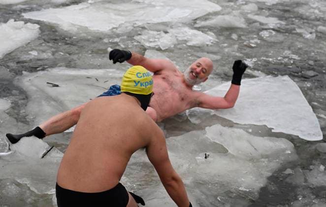 January 1, 2025, Quebec, Pq, Canada: Francis Vachon lies on the floating ice on the St.Lawrence river for a Polar Bear swim on New Year s Day in Quebec City, Wednesday, Jan. 1, 2025. Quebec Canada  - ZUMAc35_ 20250101_zaf_c35_008 Copyright: xJacquesxBoissinotx