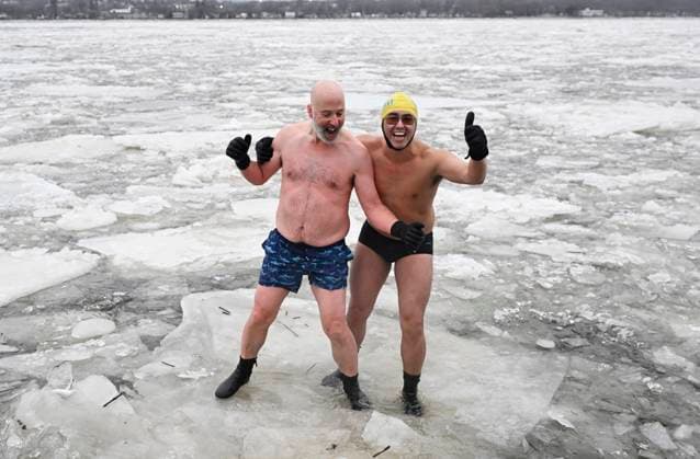 January 1, 2025, Quebec, Pq, Canada: Organiser Francis Vachon, left, and Ricardo Pan Neves stand lies on floating ice on the St.Lawrence river for a Polar Bear swim on New Year s Day in Quebec City, Wednesday, Jan. 1, 2025. Quebec Canada  - ZUMAc35_ 20250101_zaf_c35_009 Copyright: xJacquesxBoissinotx