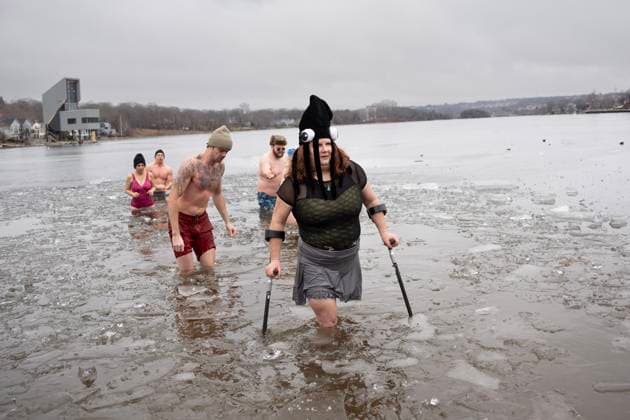January 1, 2025, Dartmouth, Ns, Canada: Vicki Morton exits the ice-filled water in Lake Banook during the annual polar bear swim on New Year s Day in Dartmouth, N.S., Wednesday, Jan. 1, 2025. Dartmouth Canada  - ZUMAc35_ 20250101_zaf_c35_022 Copyright: xDarrenxCalabresex