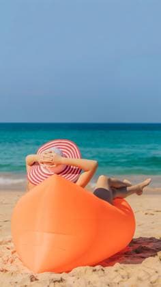Summer lifestyle portrait of pretty girl sitting on the orange inflatable sofa on the beach of tropical island. Relaxing and enjoying life on air bed. VERTICAL FORMAT for Instagram mobile story or stories size. Mobile wallpaper, model released, , 44414482.jpg, happy, VERTICAL, Instagram, mobile story, Mobile wallpaper, young, girl, inflatable, summer, sunglasses, lamzac, beach, outdoors, leisure, lifestyle, fun, beautiful, fashion, style, hammock, woman, comfortable, sitting, sea, sofa, mattress, relax, people, holiday, model, attractive, sand, ocean, slim, couple, friends, weekend, tan, smiling, cute, fruit, diet, day, eat, man, enjoy, lilo, looking, water, idyllic RECORD DATE NOT STATED