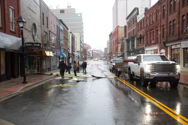 January 5, 2025, St. John s, Nl, Canada: City of St. John s temporarily blocked part of Water Street as debris was cleared from the street on Sunday, January 5, 2025. Environment Canada has issued weather warnings for the majority of Newfoundland and parts of Labrador, with snow, rain and high winds forecast through the day into Monday morning. St. John s Canada  - ZUMAc35_ 20250105_zaf_c35_011 Copyright: xPaulxDalyx