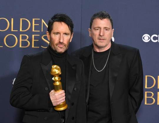 (L-R) Trent Reznor and Atticus Ross, winners of the Best Original Score - Motion Picture award for Challengers, appear backstage during the 82nd annual Golden Globe Awards at the Beverly Hilton Hotel in Beverly Hills, California on Sunday, January 5, 2025.  LAP20250105475 JIMxRUYMEN