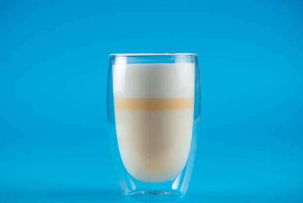 Yellow matcha latte of unripe mangoes on blue background. Matcha cocktail in double glass cup , 45820352.jpg, matcha, drink, milk, glass, yellow, mango, unripe, healthy, beverage, blue, cocktail, pouring, pour, summer, vegetarian, fresh, tasty, vegan, refreshing, mocktail, matcha drink, matcha latte, latte, smoothie, milkshake, white, freshness, foam, lifestyle RECORD DATE NOT STATED