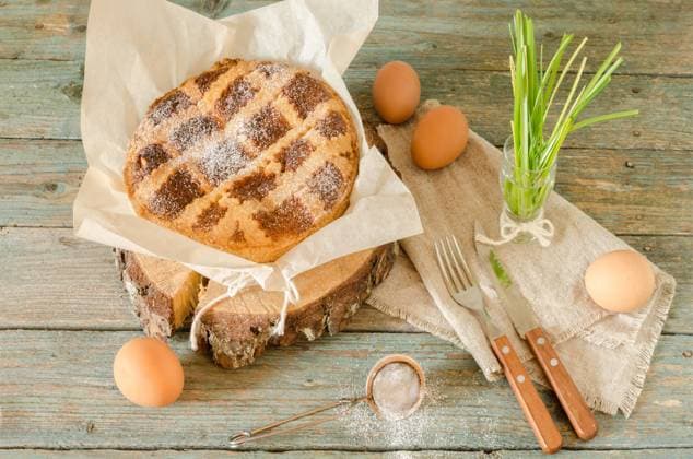 Neapolitan Easter cake with ricotta and wheat on old wooden table. Next egg, knife and fork. Rustic style. , 45839586.jpg, italian, easter, sweet, ricotta, cake, cuisine, pastry, food, dessert, italy, cheese, neopolitan, culture, baking, traditional, pie, baked, celebrations, crust, wheat, campania, tart, fork, knife, cereal, holiday, wood, cutting, color, nobody, powdered, pastiera, neapolitan, wooden, slice, eggs, table, closeup, natural, spring, easy baking recipes, nona, recipe, horizontal, photography, still life, retro style, rustic, authentic RECORD DATE NOT STATED