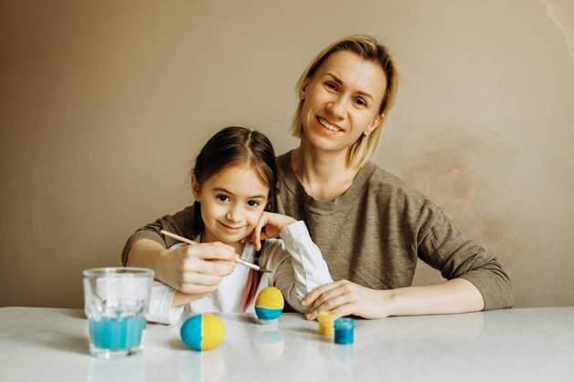 Portrait of a mother and daughter painting an egg in blue and yellow. Ukrainian family is preparing for Easter. The egg is painted in the color of the flag of Ukraine., model released, , 46038966.jpg, Ukraine, Ukrainian, stop war, patriot, mother, daughter, Easter, hope, background, family, design, hand, child, food, girl, kid, art, spring, holiday, happy, tradition, egg, paint, decoration, celebrate, beautiful, traditional, symbol, children, yellow, blue, Ukrainian flag, little girl, people, person, caucasian, portrait, day, indoor, copyspace, soft focus, selective focus, blur fun, bunny, brush, creativity, decorate, preparation, two, support RECORD DATE NOT STATED