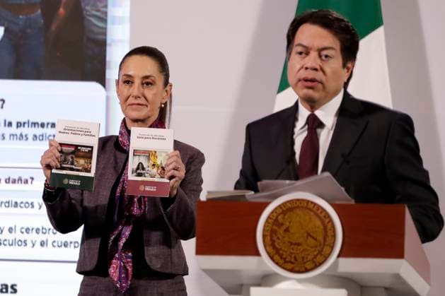 Claudia Sheinbaum Pardo President of Mexico showing books while Mario Delgado Carrillo, Secretary of Public Education speaking during the press conference where the campaign Ã¢â‚¬oeStay away from drugs, fentanyl kills you!Ã¢â‚¬Â was announced. at National Palace. on January 7, 2025 in Mexico City, Mexico. Mexico City Mexico - ZUMAe321 20250107_zia_e321_013 Copyright: xLuisxBarronx
