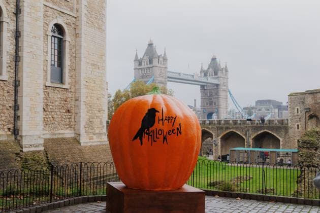 Happy Halloween pumpkin next to Tower of London London, England, United Kingdom R_VCOZ250102B-1617054-01 EDITORIAL USE ONLY