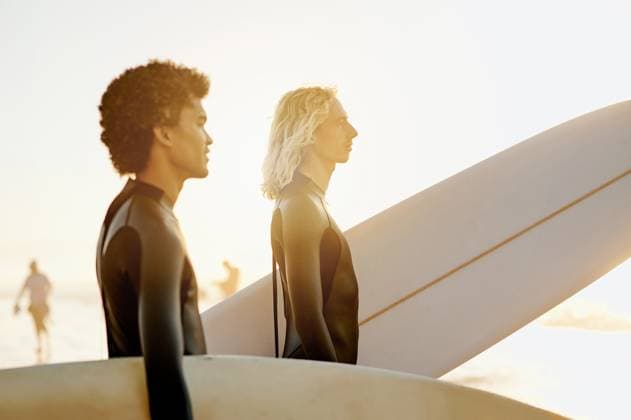 Creative Highlights Symbolbilder Men profile, surfer and friends by the sea with sunset lens flare ready for water sport in the ocean. Beach, men and thinking of young people with a surfboard about to start surfing and fitness. model released property released Copyright: xPeopleImages.comx-x 2429325x