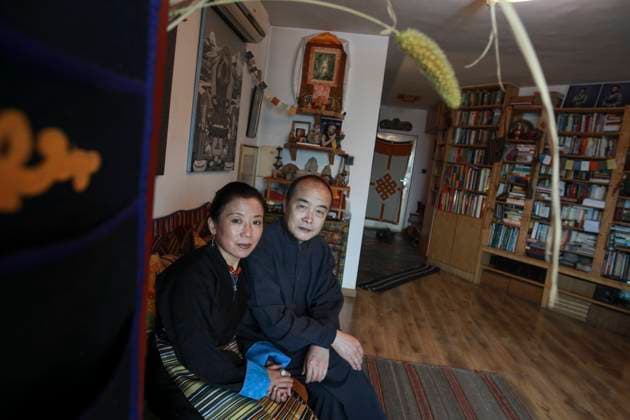 Wang Lixiong (RIGHT) and his Tibetan wife Tsering Woeser pose for a photograph at their home in Beijing. 17DEC13 == Photo by Simon Song == 19JANUARY2014 POST MAGAZINE Beijing - China EDITORIAL USE ONLY  Copyright: xx MER1401101716192441 SimonxSongx scmpphotos734313
