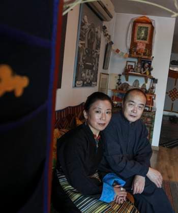 Wang Lixiong (RIGHT) and his Tibetan wife Tsering Woeser pose for a photograph at their home in Beijing. 17DEC13 == Photo by Simon Song == 19JANUARY2014 POST MAGAZINE Beijing - China EDITORIAL USE ONLY  Copyright: xx MER1401101716172440 SimonxSongx scmpphotos734314