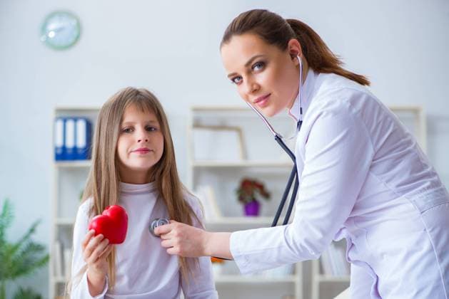 Female doctor pediatrician checking girl ,model released, Symbolfoto  Copyright: xZoonar.com ElnurxAmikishiyevx 12115324 ,model released, Symbolfoto ,property released