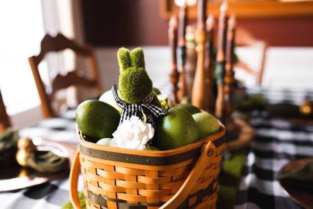 Wicker basket filled with green eggs and a moss bunny centerpiece Kalamazoo, Michigan, United States R_TBFG250119B-1559631-01