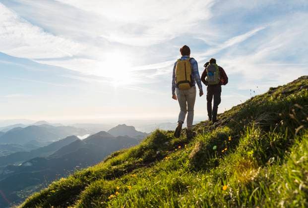 Hiker woman and man wearing backpack and walking on mountain model released, Symbolfoto, UUF33869