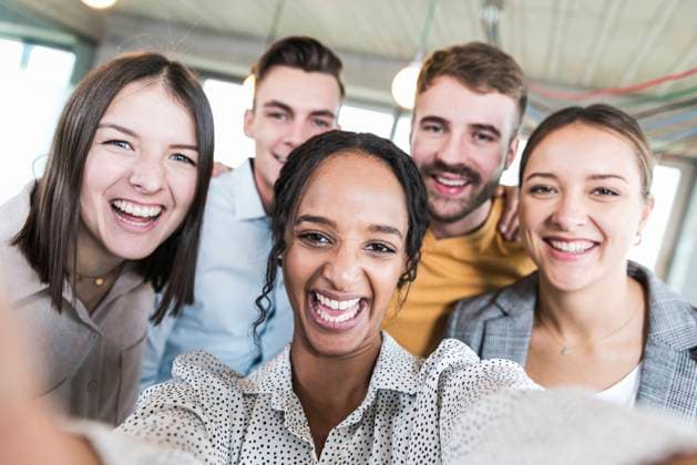 Happy business colleagues taking selfie at office model released, Symbolfoto property released, UUF33899