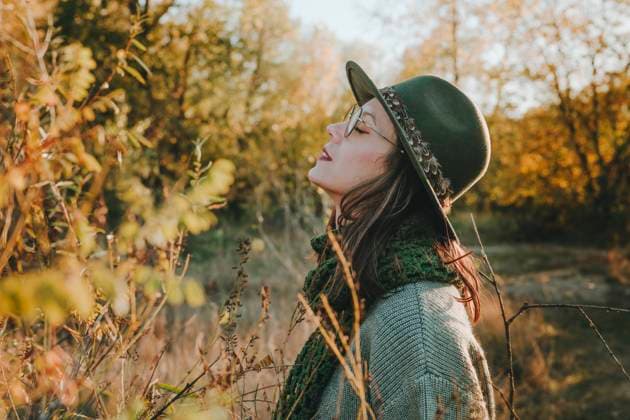 Carefree woman with eyes closed in forest model released, Symbolfoto, YTF03513