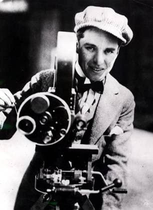 January, 1915, London, England: Young CHARLIE CHAPLIN, 26, (born April 16, 1889) cranking a film camera. Chaplin a comic actor, and director most well known for his work in the silent film era. London United Kingdom - ZUMAk09_ 19150101_nin_k09_257 Copyright: xKeystonexPressxAgencyx