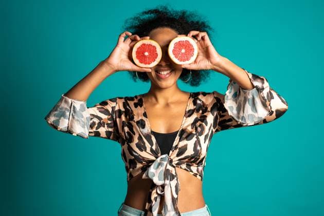 Pretty african american woman in leopard print top with two half of juicy grapefruit on blue studio background. Healthy eating, dieting, antioxidants concept. High quality photo, model released, , 48807800.jpg, adult, african american, attractive, background, beautiful, beauty, bright, care, caucasian, cheerful, citrus, closeup, color, colour, comical, copy space, coral, cute, delicious, detox, diet, eat, eating, expressing, eyes, female, food, fresh, fruit, girl, grapefruit, half, hand, happy, healthy, holding, humorous, isolated, lifestyle, person, ripe, space, summer, vacation, vacation concept, vivid lifestyle, white, woman, young RECORD DATE NOT STATED