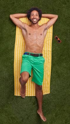 Taking some time off. A young african man relaxing on the grass, model released, , 48871236.jpg, african, man, grass, fashion, people, portrait, happy, male, smiling, smile, looking, summer, person, real, casual, handsome, ethnic, green, towel, colorful, carefree, relaxed, ethnicity, informal, happiness, color, positivity, colourful, vibrant, vivid, length, screen, clothes, background, bright, colours, colors, lying, down, coloured, colored, brightly RECORD DATE NOT STATED