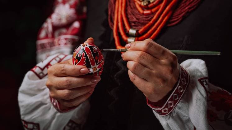 Ukrainian woman painting traditional ornamets on Easter egg - pysanka. Artist working in national costume. Preparation for Christian holiday. High quality photo, model released, , 49032644.jpg, ukrainian pattern, ukrainian ornament, bunny, celebration, holiday, paint, color, colorful, decoration, easter, egg, hand, spring, design, drawing, eggs, festive, tradition, coloring, traditional, woman, brush, symbol, home, preparation, easter egg, girl, indoor, seasonal, hands, table, art, paintbrush, handmade, egg painting, happiness, festive folk, holding, joy, ukraine, traditional pattern, pysanka, artist, multicolor, pattern, religious, painted, idea, drawer, easter patterns RECORD DATE NOT STATED