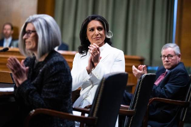 Tulsi Gabbard Hearing Jan 30 UNITED STATES - JANUARY 30: Tulsi Gabbard, center, President Donald Trump™s nominee to be Director of National Intelligence, former Sen. Richard Burr, R-N.C., and Sen. Joni Ernst, R-Iowa, applaud for Medal of Honor recipients in attendance, during Gabbard™s Senate Select Intelligence Committee confirmation hearing in Dirksen building on Thursday, January 30, 2025. Burr and Ernst introduced Gabbard to the committee. (Tom Williams CQ Roll Call) Washington DC United States EDITORIAL USE ONLY Copyright: x2025xCQ-RollxCall,xInc.x TomxWilliamsx rollcallpix163255