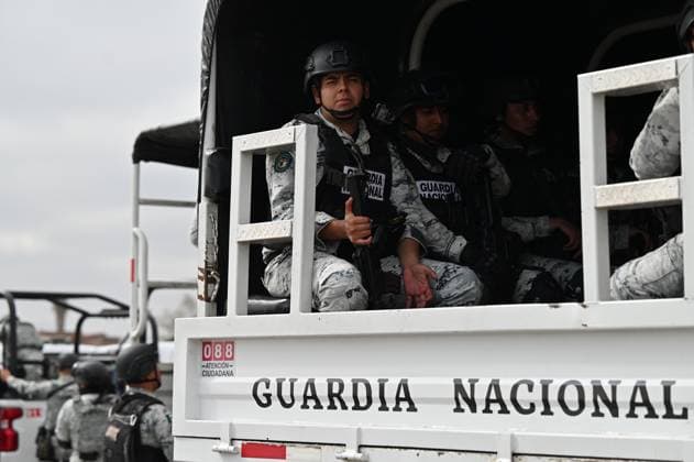 February 4, 2025, Tijuana, Baja California, Mexico: Members of the Mexican National Guard arrive at Military Air Base No. 12 near the Tijuana International Airport in Tijuana, Baja California, Mexico, on Tuesday, February 04, 2025. The arrival of MexicoÃ¢â‚¬â ¢s first 300 officers in the border city begins the 10,000 troop deployment President Claudia Sheinbaum had promised US President Donald Trump in exchange for delaying a 25-percent tariff on exported goods for a month with future negotiations to be determined. Tijuana Mexico - ZUMAm180 20250204_zip_m180_004 Copyright: xCarlosxA.xMorenox