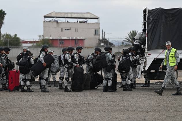 February 4, 2025, Tijuana, Baja California, Mexico: Members of the Mexican National Guard arrive at Military Air Base No. 12 near the Tijuana International Airport in Tijuana, Baja California, Mexico, on Tuesday, February 04, 2025. The arrival of MexicoÃ¢â‚¬â ¢s first 300 officers in the border city begins the 10,000 troop deployment President Claudia Sheinbaum had promised US President Donald Trump in exchange for delaying a 25-percent tariff on exported goods for a month with future negotiations to be determined. Tijuana Mexico - ZUMAm180 20250204_zip_m180_025 Copyright: xCarlosxA.xMorenox
