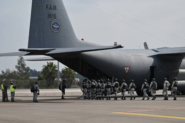 February 4, 2025, Tijuana, Baja California, Mexico: A Mexico s Air Force plane carrying members of the Mexican National Guard arrive at Military Air Base No. 12 near the Tijuana International Airport in Tijuana, Baja California, Mexico, on Tuesday, February 04, 2025. The arrival of MexicoÃ¢â‚¬â ¢s first 300 officers in the border city begins the 10,000 troop deployment President Claudia Sheinbaum had promised US President Donald Trump in exchange for delaying a 25-percent tariff on exported goods for a month with future negotiations to be determined. Tijuana Mexico - ZUMAm180 20250204_zip_m180_016 Copyright: xCarlosxA.xMorenox
