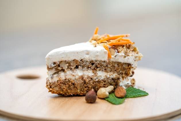 carrot cake on a wooden tray. , 49454068.jpg, food, cake, dessert, carrot, homemade, sweet, treat, cream, vegetable, pastry, delicious, decoration, walnut, fresh, tasty, baked, frosting, cooking, recipe, nutrition, bakery, healthy, appetizing, orange, gourmet, ingredient, meal, layer, snack, calorie, brown, sugar, sliced, cheese, plate, slice, bake, table, wooden, easter, calories, biscuit, organic, holiday, icing, nutritious, vegetarian, traditional, background, birthday RECORD DATE NOT STATED