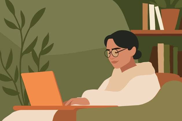 PR_ID26444_10534_BusinessIi.jpg A woman sits comfortably in a cozy corner, working on her laptop. Surrounded by plants and books, she is focused and engaged in her tasks., Property released Model Released AdalbertoRodriguez_ID26444_763069_009 Copyright: xAdalbertoxRodriguezx RECORD DATE NOT STATED