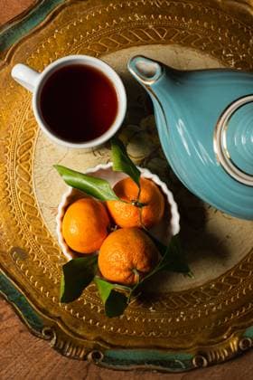 Blue teapot, mug and oranges on platter Seattle, Washington, United States CR_AAGC250205-1644228-01