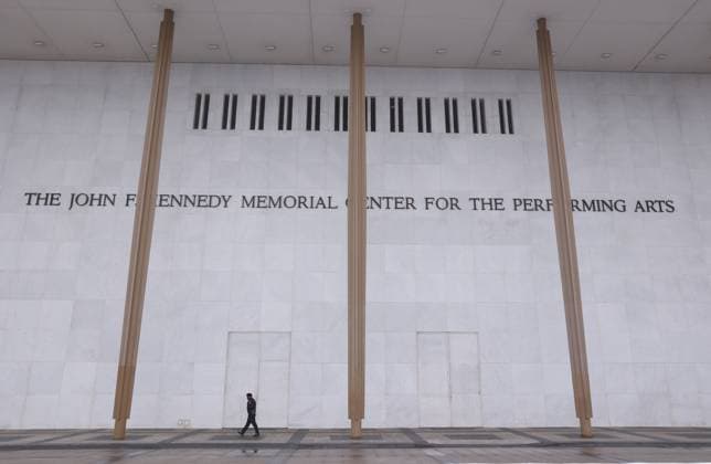 February 12, 2025, Washington Dc, Virginia, USA: A man walks past to the John F. Kennedy Center for the Performing Arts building in Washington, DC on February 12, 2025. The John F. Kennedy Center for the Performing Arts in Washington announced on Wednesday a new slate of board members appointed by President Trump N and said in a statement that the new board had elected Mr. Trump chairman. Richard Grenell, a former ambassador to Germany during the first Trump administration, was appointed the centres interim president. Washington Dc USA - ZUMAs337 20250212_znp_s337_017 Copyright: xGentxShkullakux