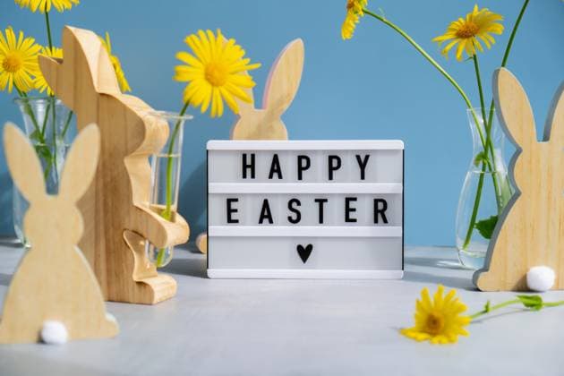 Happy Easter text on Lightbox with bunny wooden figures and fresh flowers. Easter composition content still life. Christian symbols Happy Easter text on Lightbox with bunny wooden figures and fresh flowers. Easter composition content still life. Christian symbols Copyright: xZoonar.com AnastasiiaxYanishevskax 22793769