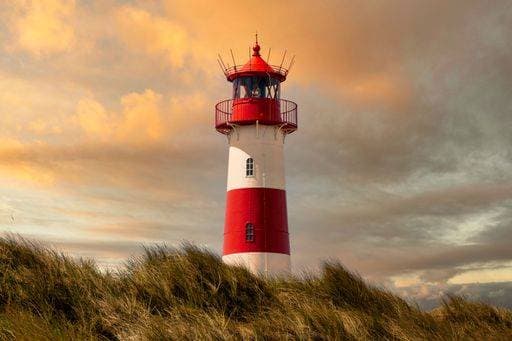 Lighthouse List on Sylt island at sunset with stunning cloud formation and colour 20975539 RECORD DATE NOT STATED