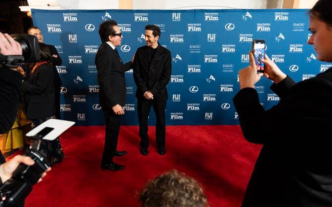February 13, 2025, Santa Barbara, California, USA: Adrien Brody is greeted by Festival Executive Director Roger Durling as he arrives at the red carpet Thursday night to receive the Cinema Vanguard Award at the 40th annual Santa Barbara International Film Festival. Spotlighting their performances in Brady CorbetÃ¢â‚¬â ¢s THE BRUTALIST, BrodyÃ¢â‚¬â ¢s portrayal of Toth highlights an immigrantÃ¢â‚¬â ¢s struggle to overcome his war-torn past and rebuild his life in a Post-War America. Pearce, in contrast, delivers a chilling, domineering performance as a wealthy art patron whose vision of American modernity collides with TothÃ¢â‚¬â ¢s. The tension between the two not only drives the narrative but also symbolizes the larger struggle between inn - ZUMAa35_ 20250213_zaf_a35_019 Copyright: xDanielxA.xAndersonx