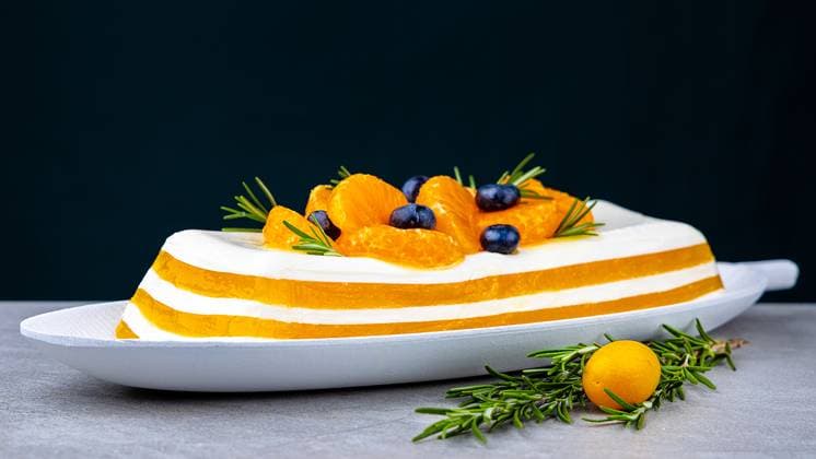 Tangerine or mango panna cotta dessert in glass on a tabletop. Sweet and sour mousse dessert. Tangerine or mango panna cotta dessert in glass on a tabletop. Sweet and sour mousse dessert. Copyright: xZoonar.com AntonxVasiljevx 22806494