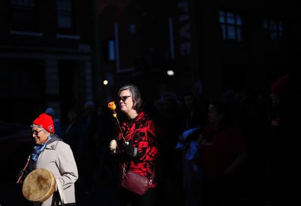February 14, 2025, Vancouver, Bc, CANADA: A woman carries a drum as another holds a single rose while participating in the annual Women s Memorial March, in Vancouver, on Friday, February 14, 2025. The march is held to honour missing and murdered Indigenous women and girls from the community with stops along the way to commemorate where women were last seen or found. Vancouver CANADA  - ZUMAc35_ 20250214_zaf_c35_119 Copyright: xDarrylxDyckx