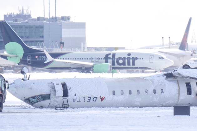 February 18, 2025, Toronto, On, CAN: A Delta Air Lines plane lies upside down at Toronto Pearson Airport on Tuesday, Feb. 18, 2025. Flight 4819 öÄi a Bombardier CRJ-900 jet operated by the Delta subsidiary Endeavor Air, crashed while landing in Toronto having flown from Minneapolis on Monday. Toronto CAN  - ZUMAc35_ 20250218_zaf_c35_172 Copyright: xChrisxYoungx