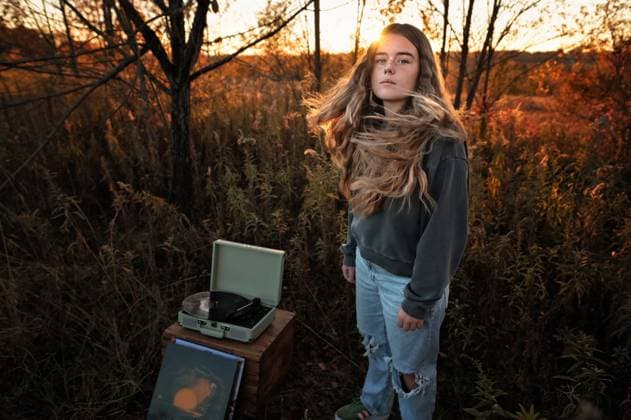 Creative Highlights Symbolfotos Teen girl long wavy hair dancing record player in field Wooster, Ohio, United States CR_JOKU250217-1644787-01 ,model released, Symbolfoto