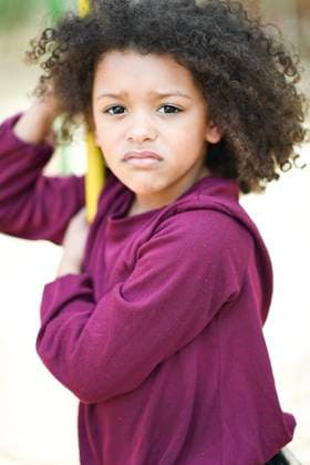 Creative Highlights Symbolfotos Close-up of a young girl with a sad expression, gripping a bar United States, Florida, Crystal River R_YWQX250218B-1649529-01 ,model released, Symbolfoto