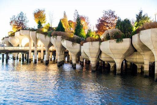 A stunning view of Little Island, a unique park on the Hudson River in New York City, featuring its distinctive concrete structures and lush greenery. 26205301 RECORD DATE NOT STATED