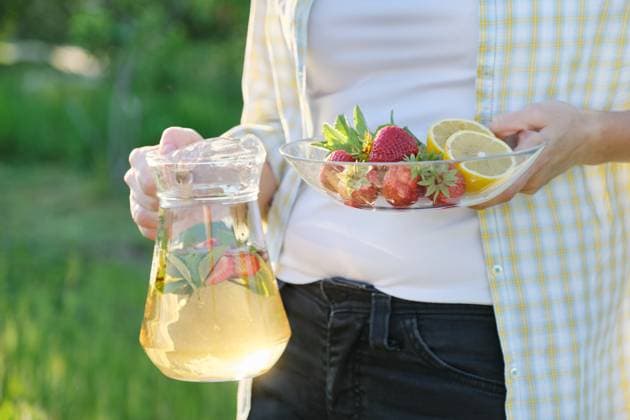 Spring summer refreshments, woman in nature holding jar of strawberry mint and lemon., model released, , 50700690.jpg, mint, lemon, strawberries, glass, drink, beverage, woman, hands, ice, green, strawberry, food, sweet, cold, cocktail, summer, juice, ingredient, red, fresh, water, refreshment, freshness, leaf, citrus, lemonade, berry, healthy, cool, liquid, background, slice, refreshing, closeup, herb, vitamin, white, straw, organic, gin, homemade, tea, vegetarian, rustic, antioxidant, herbal, spring, seasonal, fruit RECORD DATE NOT STATED